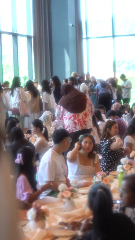 Guests sitting in the picnic area inside the hall