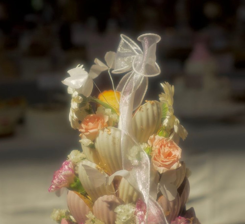 A flower and madeleine tower tied with ribbon at Cakewalk
