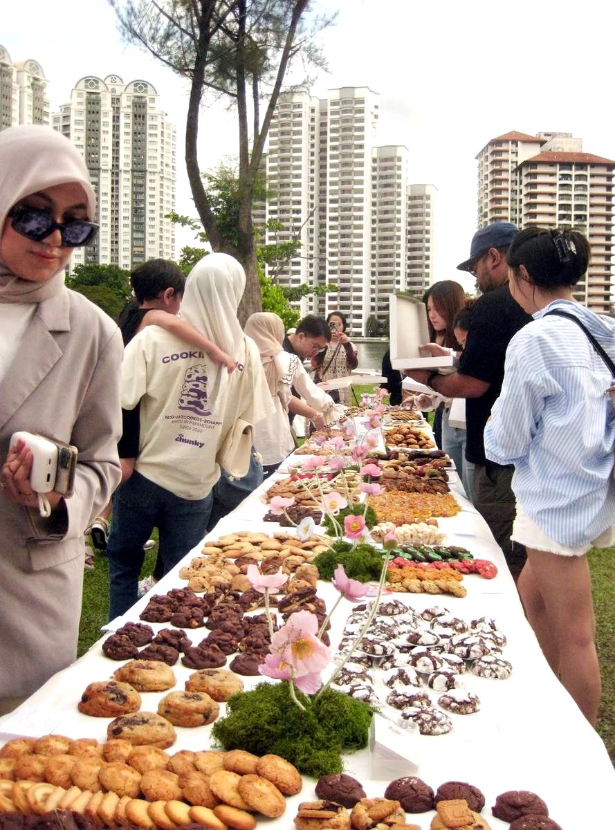 Guests browsing a long cookie table