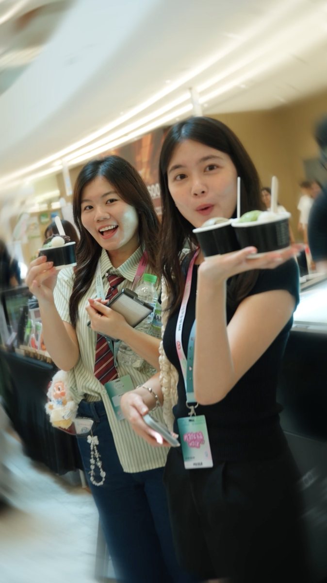 Two friends showing off matcha desserts at MATCHAWALK